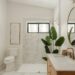 Modern bathroom with marble accents and a large plant.