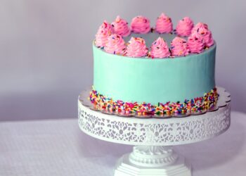 A cheerful birthday cake, bursting with excitement and joy.