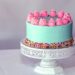 A cheerful birthday cake, bursting with excitement and joy.